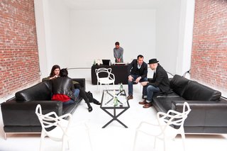 DJ Brendan Fallis spun tunes in the lounge featuring Kartell Masters Chairs by Philippe Starck. Tip Top side tables were also provided by Kartell for the exhibition.