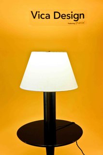 Designed by architect Annabelle Selldorf for Vica Design, the Star Table Lamp base is made of oil-rubbed, blackened steel and the shade is made of onionskin paper. Also warmly lit by Pharox.