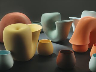 Bakker’s girlfriend, fashion and furniture designer Brecht Duijf, sometimes suggests colors for designs. "I would not have been able to think of these colors," Bakker says, holding up tiny ceramic chips she selected to determine the palette for Jug, a water carafe with a neck bent over a drinking cup, looking like a primordial creature feeding its young.