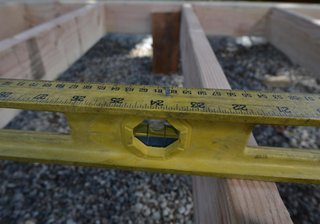 Leveling the wood framing.