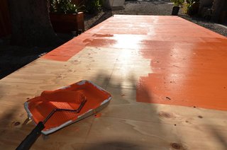 Painting the base coat bright orange.