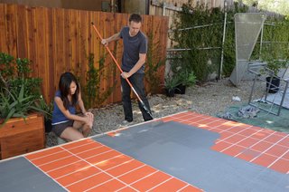 Taping the grid on the platform then painting the platform light grey.
