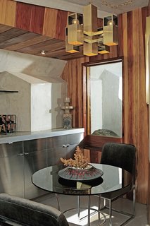 John Lautner's Desert Rose - Photo 3 of 5 - The eat-in kitchen features poured-in-place concrete countertops and redwood wall paneling.
