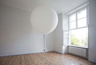 Lítill Takes Flight in Berlin - Photo 5 of 7 - A helium-filled weather balloon transports a handblown terrarium by Lítill in the Jette installation. Coleman's Jette and Fabrik installations occupy two separate rooms at Direktorenhaus in central Berlin. The large weather ballon that carries a knit rope suspended Litiil terrarium from side to side across the length a gallery room is helium-filled and serves as a new experiment for the artist in terms of in animating these formerly fixed tabletop pieces. This is the designer's first exhibition in Europe, following her successful window installation projects at E.R. Butler & Co. in Soho, Trina Turk in NYC's Meatpacking District as well as at the Ace Hotel in Palm Springs and other design venues.