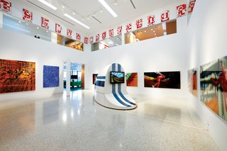 The "white cube" gallery space off the dining area displays work by contemporary Australian artists including Louise Forthun and Patricia Piccinini. Clerestory windows offer glimpses into the second-floor library and private bedrooms.