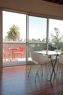 Her Lasalle patio set is from Target and her Engineer dining table and Orbit armchairs are from CB2.