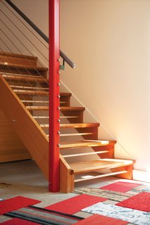 Though Cooper kept the fixtures rather humble, she did run a splashy red motif throughout. The pillars make a statement with Painter’s Choice Gloss Apple Red.