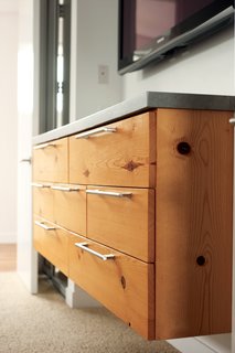 Mount Up<br><br>Keeping a house clean can be a challenge for anyone, but Cooper made things just a tick easier by getting her furniture up off the floor. "I chose to wall mount lots of the furniture so that I could easily sweep or let my Roomba run underneath without crashing into the legs." She used knotty pine for cabinets and a chest of drawers of her own design and suggests installing wood blocking behind the drywall for extra support.<br><br>irobot.com