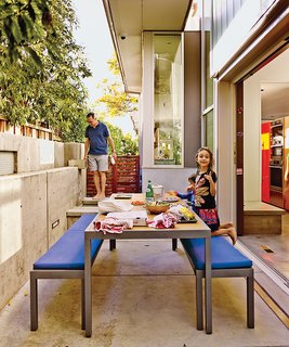 This House Doesn't Hold Back on Colorful Details - Photo 8 of 11 - The patio table and benches are from Crate and Barrel.