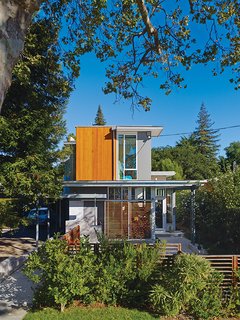 This House Doesn't Hold Back on Colorful Details - Photo 4 of 11 - Movable wood screens on the exterior provide shade to alleviate heat gain. The home is color coded to correspond to the outside elements.