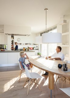 The kitchen of a home on an Amsterdam canal "is where it all happens," says Van Zeijl. As the hub of the home, the room is situated at the front of the house and features a minimal palette and Belgian granite countertops. The table is by Pilat & Pilat and the pendants are from It’s About Romi.