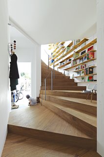 Three-year-old Ran Sugiura peers out the front door of her Tokyo home, a concept-driven yet surprisingly livable piece of architecture that her parents describe as uniquely well suited to the family’s flexible "futon lifestyle."