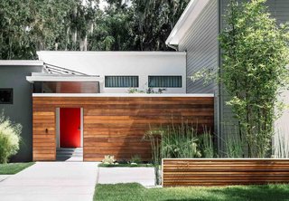 An enclosed courtyard, bordred by ipe, is arguably the most distinctive feature of the house that the Phil Kean Design Group created for Adriana De Azevedo, Daniel Coelho, and their two daughters in Winter Park, Florida.