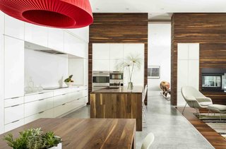 The kitchen counters and islands reflect a relatively simple material palette.