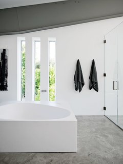 A Boffi tub is a defining feature in the master bath.