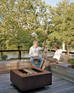 A mix of vintage finds and pieces designed by Mathesius, including a Cor-Ten steel fire pit on the second-floor deck, furnish a majority of the home.