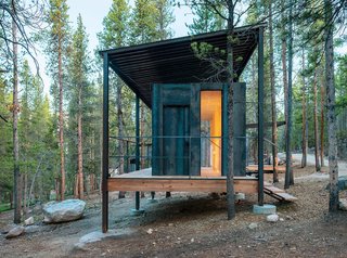 The Outward Bound cabins' steel frames lift the structures above a three-foot snowpack while supporting corrugated-steel "snow roofs."