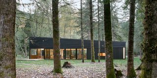 30 All-Black Exterior Modern Homes - Photo 4 of 30 - The Andersen Architectural Collection’s Eagle windows and doors provide the panes and passageways of the home.