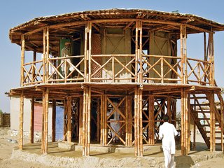 Yasmeen Lari - Photo 1 of 2 - In the aftermath of a 2005 earthquake in the Hazara and Kashmir regions of Pakistan, Lari came up with a bamboo shelter system called KaravanRoof that is designed with low costs and a low-carbon footprint. The structures are typically built with adobe-and-mud walls and strong bamboo cross bracing—all of which are raw materials available locally and suited to both rural and urban areas.