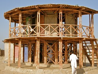 Q&A with Pakistan's First Female Architect - Photo 2 of 3 - In the aftermath of a 2005 earthquake in Pakistan, Lari develeoped a bamboo shelter system called KaravanRoof, built with adobe-and-mud walls and strong bamboo cross-bracing.