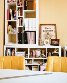 A bookshelf in Quite Strong’s studio <br><br>holds a tongue-in-cheek motivational motto.