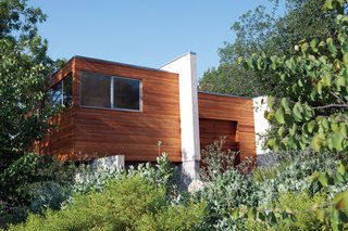 Another view of the house reveals a surprising sense of lightness; from certain angles, the structure appears to float above the landscape.
