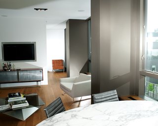 Architect Cass Calder Smith embarked on a gut renovation to join two apartments inside a SoHo building, resulting in a 1,600-square-foot residence. He redid the floors in oak and redesigned the wall of windows that frames views to the east.