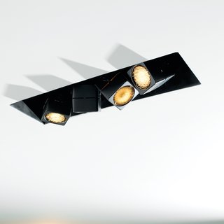 Once the sun sets, the main spaces are illuminated via pieces from No. 8 Lighting, recessed within a three-inch-deep slot in the ceiling.