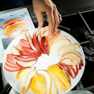 White platters from Crate & Barrel allowed the food—lox, crudités, and cornichons—to stand out atop the Saarinen table.