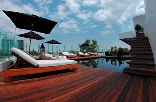 The pool, overlooking the city, also connects to a private deck for the Demetria suite. Notable guests include Elton John, Kylie Minogue, and Willem Dafoe.
