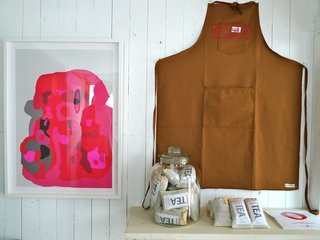 This apron and green tea are among the products sold by Commune to benefit tsunami victims. Photo courtesy Commune design.