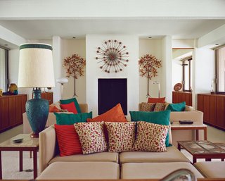 Architect Maurice McKenzie designed not just the home's symmetrical form but the seating in the living room too.