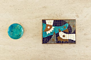 Elsewhere, secondhand finds and cool ceramics jazz up shelves and countertops.
