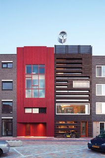 Hand-Made Houses - Photo 3 of 7 - The striking black facade of Pieter Weijnen's home is the result of the Japanese practice of charring wood.