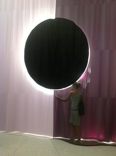 In the Dutch pavilion, moving curtains stop at 90 second-intervals, creating alignments between the fabric, like this eclipse.
