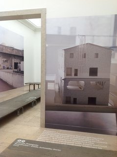 Projects in the German pavilion show large-scale photos of models and buildings depicting how the country's architects are reworking the existing fabric of the city. The exhibition reuses the temporary sidewalks that are used when Venice floods.