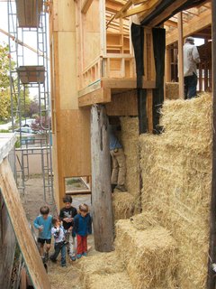 Straw Dogs<br><br>"Straw is basically a waste material," says Tilt. "Farmers used to burn rice straw, but now they’re baling it up to sell, which takes tons of CO2 out of the atmosphere." It’s also a stellar source of insulation, both thermal and acoustic. With the guidance of structural engineer Kevin Donahue, Arkin Tilt, the couple, and a group of their friends and neighbors pitched in for a daylong "bale raising." To minimize the straw’s volume within the walls (they used 150 bales), the architects tipped the bales on edge, placed them between structural wood I-joists used as posts, and finished them off with welded wire mesh and lime plaster.