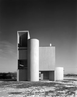 Modernist Angular Residence with Vertical Cedar Siding - Photo 2 of 6 - The geometric exterior encloses an orderly vertical arrangement of living space.