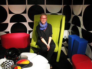 Designer Ghislaine Vinas with her 1960s inspired selections. Graphic wallpaper by Flavor Paper.<br><br>How does one balance so many bright colors when they’re decorating a room? "I always say this: getting a white base—and I mean a really white base, not cream or beige—is really important for contemporary interiors," Vinas says. "In this case we have a really graphic black and white and it’s like painting really. You have to balance out the colors. It’s all about composition and getting the colors right."
