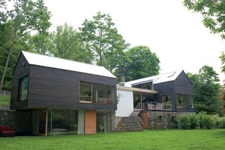 Gable-Roofed Rural Weekend Home in Connecticut - Photo 5 of 9 - Consisting of two barnlike volumes set <br><br>atop a stone foundation, the Depot House offers <br><br>a locally rooted vision <br><br>of New England modernism.