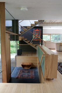 Gable-Roofed Rural Weekend Home in Connecticut - Photo 2 of 9 - The couple made the house feel even more spacious by flooding a series of levels with natural light.