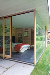 Gable-Roofed Rural Weekend Home in Connecticut - Photo 6 of 9 - Maybe the most enviable bunk in the house, <br><br>the downstairs guest room has an unadulterated view out into the trees.
