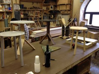 The gentlemen of Fort Standard work in a community space in Red Hook to produce wooden and metal tables and a variety of other products such as bottle openers, canisters, wooden blocks, bracelets, and belt buckles.