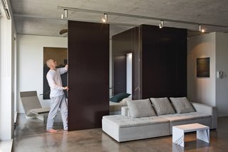The couple designed and built every piece of furniture in the apartment except for the Mezzo sofa from BoConcept. The coffee table can be flipped on its side to serve as a barstool. How did they test it to make sure it would support a person’s weight? "Olek jumped and sat on it," says Nix, before adding, "He graduated from an engineering program."