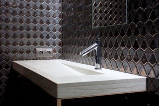 Selective D.I.YNix and Novak-Zemplinski made the narrow concrete sinks with tilted basins in the bathrooms. "We couldn’t find any sinks we liked," says Nix. "So we decided to make our own. But those are the most expensive sinks ever, at least in terms of man-hours." Novak-Zemplinski concurs—while they are happy with the way the sinks turned out, "one of the lessons we learned is that some things are not worth doing yourself."