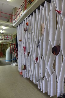 Dutch Design Week 2012, Pt. 1 - Photo 20 of 24 - Amsterdam-based designer Elise Oussoren's "Elast-ic" storage system is made from wide elastic straps sewn together to hold objects in its individual pockets.