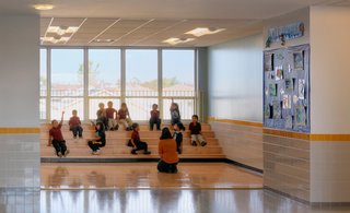 Part of this flexibility is a redefining of the idea of the classroom and other places where students congregate for learning. At PS 861, the Staten Island school of Civic Leadership, students assemble for class on steps in a more open environment. Building designed by Mitchell/Giurgola Architects. Photo by ©Jeff Goldberg/Esto.