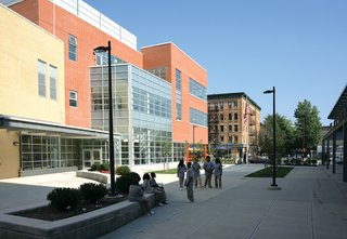 The urban space is an inspiration for how buildings can facilitate interaction. One example is the Frank R. Conwell School Campus in Jersey City, New Jersey, by Gruzen Samton and IBI Group. "Over and over you see that the connection to the street is important, whether it's a collection of buildings or a single building it's conceived of in an urban way," Mellins says. "This open area becomes like a main street that you can look across and see what's happening." This allows for both easy planning of events and chance encounters. Photo by James D’Addio." /dwell-photo photoId="6133532723861237760" caption="REED Academy in Oakland, New Jersey, is a school for children with autism spectrum disorders. Though it is located in a suburban office park, it, too, utilizes the best parts of city life to enhance learning in terms of socialization and positive interaction within the broader society. "It was clear that the idea of the street encounter still resonates even if it’s in a suburban environment," Claire Weisz, principle of WXY Architecture explains. "Somehow human beings still think as if they are in villages." Photo by Paul Warchol." /dwell-photo photoId="6133532725501210624" caption="One unique aspect of REED Academy is that rather than having large hallways with monotonous rows of doors one walks through the school along street-like paths that include a series of alcoves. "The idea is that as you pass through the hallway it becomes a different space," Weisz says. This helps students at REED slowly become comfortable with moving through a building and with interacting socially. "It could be that a student does a store for a day, or someone puts something special there. We had to do something that didn’t give too many clues, because part of it is teaching the kids the grid of a building," Weisz further explains. "It’s a place where everyone feels safe and accepted, but also they can learn to cope with more stimulus. It’s this thing where the building is used to build capacity. It made me think: This is not so different than you and I." Photo ©Albert Vecerka/Esto." /dwell-photo photoId="6133532727434895360" caption="The bowstrings of several arches extend beyond the central space, providing ample amounts of natural light. "The central space is a kind of town square," Mellins says. "And what you learn in a town square, or can learn and observe, is how people interact."" /dwell-photo photoId="6133532728722546688" caption="Many of the schools represented in Edgeless are for students requiring different methods of education, from an emphasis on the arts or teaching those with special needs. The possibilities of learning in new or different ways creates opportunities for new spaces to assist in that learning. <br><br>"All of a sudden your teacher isn’t teaching a classroom of kids. The classroom is just a place that the teacher and student go to periodically during the day when they need to be there," Weisz explains. "This is a school that’s designed around a way to teach, not a school that was designed because they needed a place to house people." Photo ©Albert Vecerka/Esto." /dwell-photo photoId="6133532731423567872" caption="Part of the concept of Edgeless-ness includes exploring the outside and nature within a city, further expanding what a classroom can be. At the Rogers Marvel designed Stephen Gaynor School in New York, students take advantage of green spaces. Photo ©David Sundberg/Esto." /dwell-photo photoId="6133532734238056448" caption="St. Albans School in Washington, DC, by Skidmore, Owings & Merrill is located on a beautiful campus in the shadow of the Olmsted-designed National Cathedral. Facing the challenge of fitting in within this existing, historic space, the architects create paths on the roof and underneath the buildings that "allow for a meandering through the campus" in order to "take on a quality of a pilgrimage in the shadow of the Cathedral," Mellins says. Photo ©Robert Polidori." /dwell-photo photoId="6133532736536424448" caption="Part of being Edgeless is in the way a school fits within a community, especially in an urban environment. The Frank Sinatra School of the Arts in Queens, New York, thrives in a bustling area of Astoria. "The school gets so much out of being in that lively neighborhood, and that neighborhood gets more lively because of the presence of the school. There's a symbiosis," Mellins says. "The most dramatic translation of edgeless-ness is literal transparency. You can see the ballet students at the bar from the street." School designed by Ennead Architects. Photo by ©Aislinn Weidele/Ennead Architects.