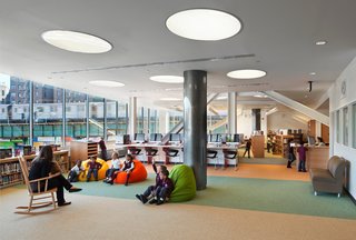 Schools are often large buildings that sit empty while not in use. New Settlement Community Campus in the Bronx is an example of a community benefiting from an educational facility as physical space. The public school is merged with a community center, and its facilities, including an amphitheater, are open to the public after hours.<br><br>New Settlement Community Campus was designed by Dattner Architects in association with Edelman Sultan Knox Wood/Architects. Photo by ©David Sundberg/Esto.