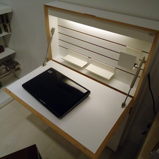 New from Resource Furniture - Photo 3 of 9 - One of the pieces installed in the model apartment is a fold-out desk cabinet called the Flatmate that's only four inches deep when closed. It features built-in interior lighting, cubbyholes along the sides for storage, and a power strip.